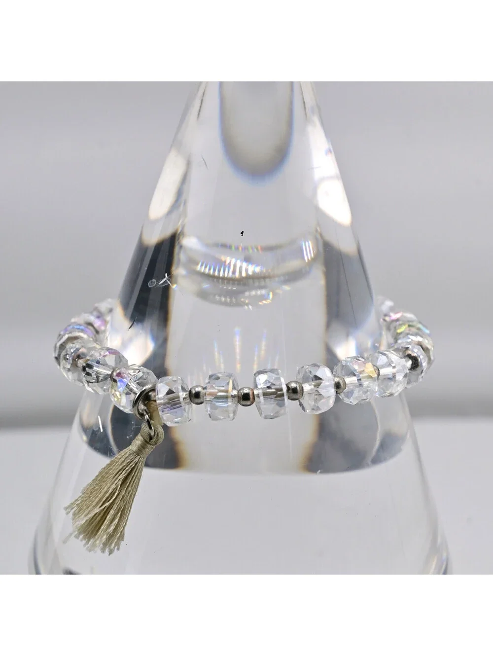 FACETED CRYSTAL STRETCH BRACELET WITH TASSLE